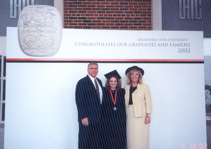 Leslie sharing the pedestal with her parents
